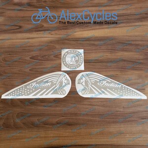 May include: A collection of white motorcycle decals featuring the Indian Motorcycle logo. The decals include a Native American headdress and the text "Indian Motorcycle 1901". The decals are in various shapes and sizes.