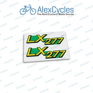 Puede incluir: Dos calcomanías con el texto "LX277" en amarillo, verde y negro. Las calcomanías están sobre un fondo blanco. La esquina superior derecha de la imagen tiene el texto "AlexCycles The Best Custom Made Decals".