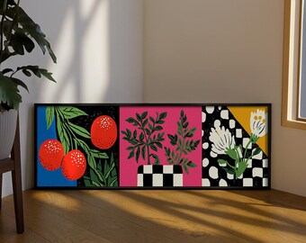 May include: A rectangular framed wall art piece featuring three distinct panels. The left panel shows red oranges on green branches against a blue background. The center panel displays green plants in a black and white checkered pot on a pink background. The right panel depicts white flowers against a black and white checkered pattern and a yellow triangle.