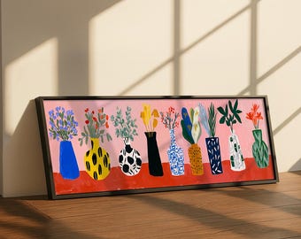 May include: A framed art print featuring a series of colorful vases, each holding different types of flowers and foliage. The vases are painted in various styles, including polka dots and stripes, set against a pink background.