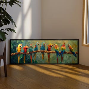 May include: A rectangular wall art print in a black frame featuring a horizontal oil painting of eight colorful macaws perched on a thick tree branch. The parrots display vibrant plumage in shades of red, yellow, blue, and green against a foliage background.