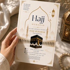 May include: A Hajj Mubarak invitation card with a gold and cream colour scheme. The card displays the text "Hajj Mubarak Gathering" and event details. The image includes a representation of the Kaaba and Islamic architectural features.