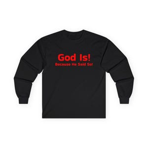 May include: Black long-sleeved top featuring the red text "God Is! Because He Said So!". The garment is made from a soft, comfortable fabric.