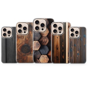 May include: A collection of five phone cases with wood grain designs. The cases feature various wood textures, including dark charred wood, knotty wood, and a pattern of stacked logs. Each case has a clear border.