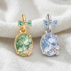 May include: A set of three ceramic mugs with a speckled, matte finish in cream, light grey, and dark grey. Each mug has a simple, minimalist design and a rounded handle.