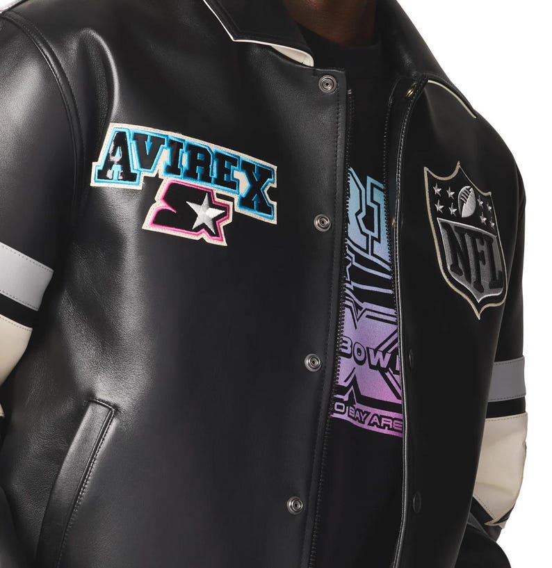 May include: Black leather jacket with white and gray accents. Features the "AVIREX" and "Starter" logos on the chest, and an "NFL" patch on the sleeve. The jacket has a button-up front and a white collar.