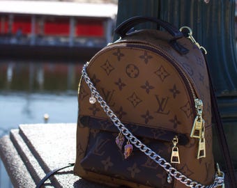 Bijou de sac La Belle et le Clochard Disney - Or ou argent