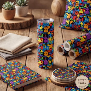 May include: A collection of retro pixel art themed items, including a tumbler, notebook, pillow, wrapping paper rolls, and coasters. The items feature a colorful pixelated design with various shapes and characters. The items are arranged on a wooden surface.