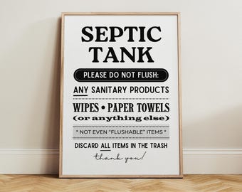 May include: A framed sign with the words "SEPTIC TANK" in large, bold, black letters. Below, it reads "PLEASE DO NOT FLUSH:" followed by a list of items not to flush. The sign is on a white background with a wooden frame.