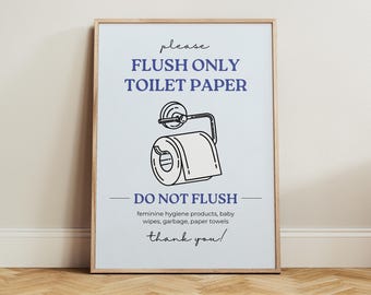 May include: A framed print with a light blue background and text that reads "FLUSH ONLY TOILET PAPER". Below the text is a line drawing of a toilet paper roll. The text "DO NOT FLUSH" is below the drawing, followed by a list of items not to flush. The words "thank you!" are at the bottom.