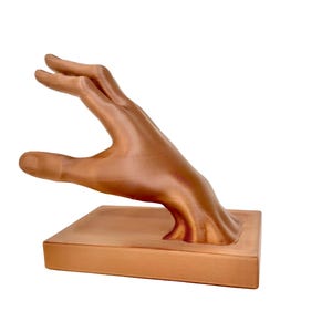 dali inspired hand bookend modern bookshelf decor