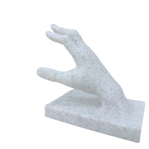 surreal home decor hand book holder close up detail