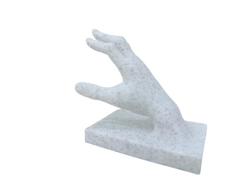 surreal home decor hand book holder close up detail