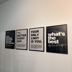 May include: Four framed motivational posters with black frames and white text. The posters display phrases like "Do it anyway," "1% better every day," and "Your only limit is you." The last poster says "what's the best that could happen."