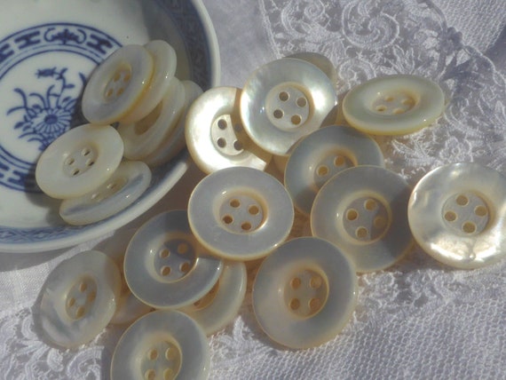 Mother of Pearl Button Raised Edge 4 Hole Mother of Pearl Button Raised Edge 4 Hole