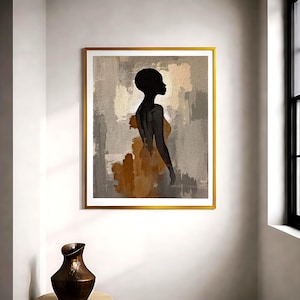 K&ouml;nnte beinhalten: Ein gerahmter Kunstdruck mit der schwarzen Silhouette einer Person im Profil vor einem abstrakten Hintergrund aus strukturierten beigen, grauen und braunen Pinselstrichen. Das Kunstwerk ist in einem d&uuml;nnen, goldfarbenen Metallrahmen gefasst.