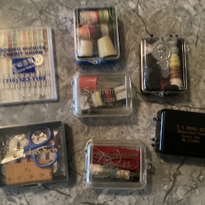 Set of 7 Vintage advertising sewing travel kits, Seagram’s sewing kit, Boeing sewing kit, Pease Homes ad sewing kit,  Ohio business sew kit