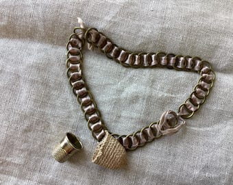 Antique crocheted thimble holder on ribbon and chain, crocheted thimble holder and thimble