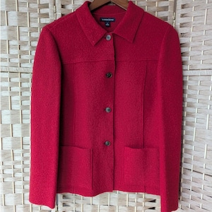 May include: A red Lands' End wool jacket with a collared neckline, three buttons, and two front pockets. The jacket is hanging on a wooden hanger against a neutral background.