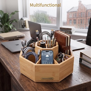 May include: A rotating bamboo organiser with an octagonal shape featuring multiple compartments for storing charging cables, a smartphone, pens, tools, and a notebook. The base includes a small metal plaque labelled Rotating Bamboo Organiser.