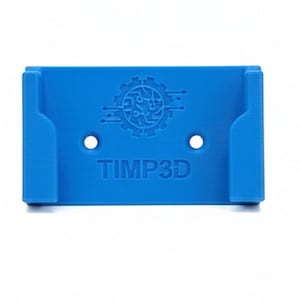 May include: A bright blue 3D-printed wall mount with the text "TIMP3D" and a gear-shaped logo. The mount has two holes and two curved side supports. The object is designed to hold an item.