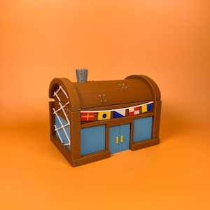 May include: A brown and blue building with a chimney and flags. The building has blue windows and doors with yellow handles. The roof is brown with metal accents. The building is on an orange background.