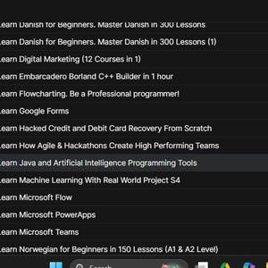 May include: A screenshot of a computer screen displaying a list of Udemy courses. The courses are organized in a list format with titles such as "Learn Java and Artificial Intelligence Programming Tools". The background is dark.