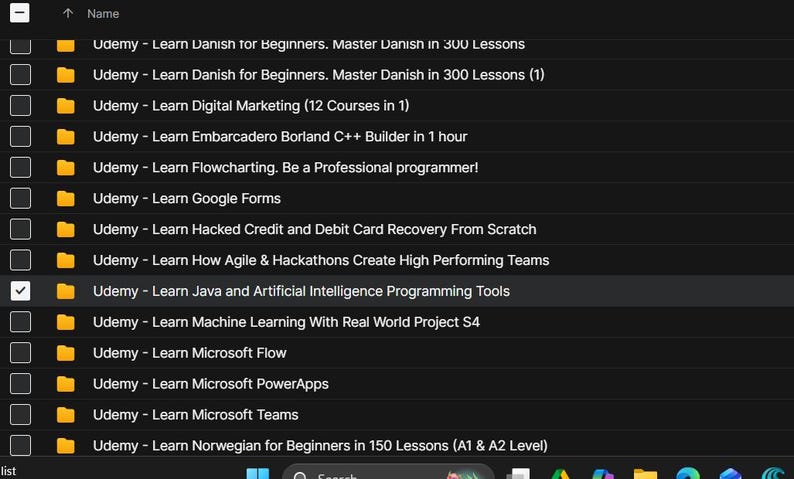 May include: A screenshot of a computer screen displaying a list of Udemy courses. The courses are organized in a list format with titles such as "Learn Java and Artificial Intelligence Programming Tools". The background is dark.