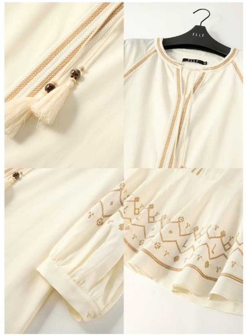 May include: Ivory-colored blouse with intricate embroidered details in a warm brown hue. Features a round neckline, long sleeves, and decorative tassels. The design includes geometric patterns and delicate stitching.