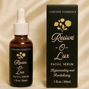May include: A brown glass bottle and a black box of Cascade Cosmetics Revive -O- Lux Facial Serum. The bottle has a white dropper and gold text. The box has gold floral accents and text that reads "Rejuvenating and Revitalizing", 1 fl.oz./30mL.