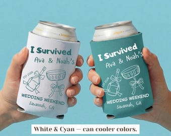May include: Two foam can coolers, one white and one teal, featuring the text I Survived Ava & Noah's Wedding Weekend Savannah, GA, EST 2026, and line art illustrations of a champagne bottle and a coupe glass with bows.