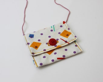 small neck pouch with geometrical pattern in purple, yellow, red and blue / small coin purse