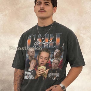 May include: A charcoal grey short-sleeve t-shirt featuring a graphic print of Carl Gallagher with the text "CARL Gallagher" in a metallic gradient font. The design includes multiple images of the character and the watermark text "Picostoreco".