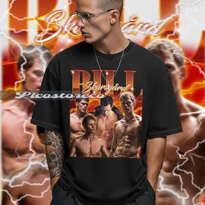 May include: Black t-shirt featuring a graphic of Bill Skarsgård with a vintage design. The design includes multiple images of the actor and the name "Bill Skarsgård" in a retro font. The background has a lightning bolt design.