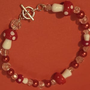 Red & white mushroom bracelet. 10" so its not tight. Toggle closure.