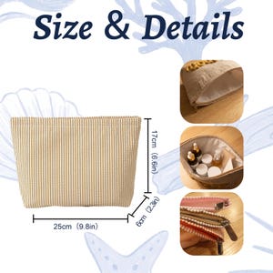 May include: A beige and white striped zippered pouch with a textured fabric exterior. Dimensions are 9.8 inches wide, 6.6 inches high, and 2.3 inches deep. The interior is lined with a light-colored fabric, and the pouch features a metal zipper closure.