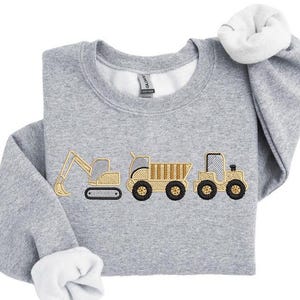 May include: A set of three ceramic mugs with a speckled, matte finish. Each mug features a different color: light blue, cream, and gray. The mugs have a simple, modern design, perfect for coffee or tea.