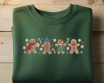 Broderidesign med pepparkaksfamilj, söt julpepparkakspojke och flicka, triosömfil med julkakor, broderi med pepparmyntsgodis och julgranskulor