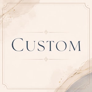 May include: A digital graphic with the word "CUSTOM" in a dark blue serif font, centered on a light beige background with watercolor-style washes and gold accents. The design includes a decorative border.