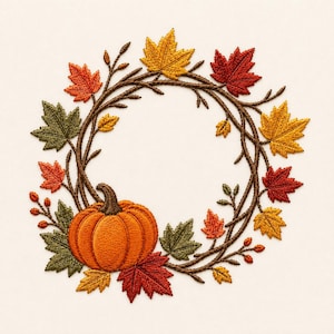 May include: An embroidery design featuring a circular wreath of brown intertwined branches adorned with autumn leaves in shades of red, orange, yellow, and green, with a single orange pumpkin positioned at the bottom left of the wreath.