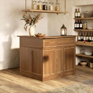May include: A wooden bar with a light brown finish, featuring a drawer and paneled doors with white trim. A vase with dried flowers, a wooden bowl, and a lantern with a candle sit on top. Shelves with jars and bottles are in the background.