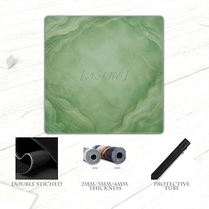 May include: A green and gold personalized mousepad with the text "[NAME]" in the center. The mousepad has a marble-like design. The image also shows a close-up of the double-stitched edge, rolled-up mousepads, and a protective tube.