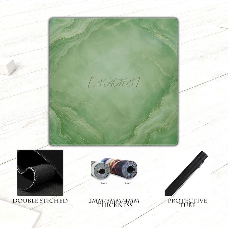 May include: A green and gold personalized mousepad with the text "[NAME]" in the center. The mousepad has a marble-like design. The image also shows a close-up of the double-stitched edge, rolled-up mousepads, and a protective tube.