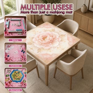 May include: A square table with a large pink peony design, surrounded by four beige chairs. The image also shows a mahjong set, card games, and board games, with the text "MULTIPLE USESE" and "More than just a mahjong mat".
