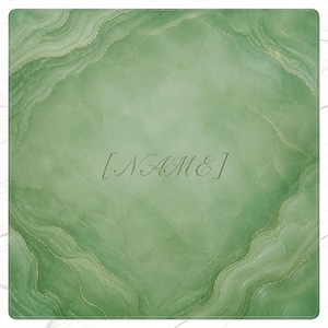 May include: A square, green decorative mat with a marbled design and gold accents. The mat features the word "NAME" in a stylized font. The edges have a wavy pattern, and the background is a light green color.