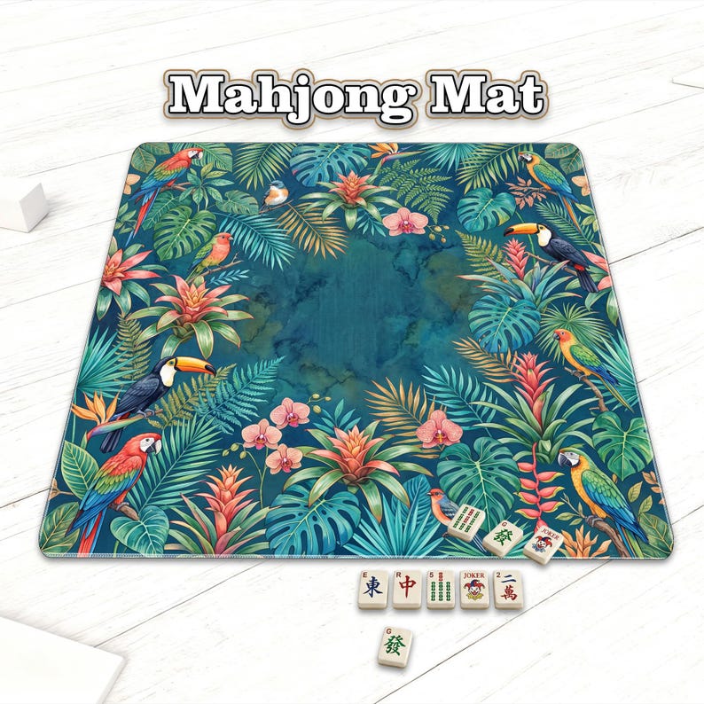 May include: A rectangular Mahjong Mat with a tropical design featuring parrots, toucans, and lush foliage. The mat has a teal marble-like center and is surrounded by vibrant flowers and leaves. Several Mahjong tiles are visible.