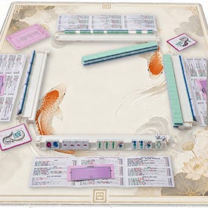 May include: A complete Mahjong set with a cream-colored playing surface featuring koi fish illustrations. The set includes tiles, racks, dice, and score cards. The tiles are white with black symbols and green accents. The set is ready for play.
