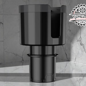 May include: A black car cup holder with a dual design. The top section has a cup holder and a phone holder. The base is designed to fit into a car's existing cup holder. The logo "YEHEZKEL CAR ACCESSORIES" is visible.