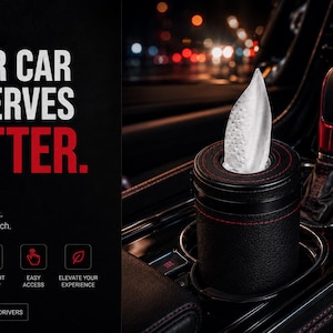 Könnte beinhalten: Ein schwarzer Taschentuchhalter für Autos mit roten Nähten, der weiße Taschentücher enthält. Der Halter befindet sich in einer Autokonsole neben einem rot-schwarzen Schalthebel. Der Text lautet "YOUR CAR DESERVES BETTER."