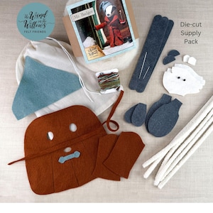 May include: A felt craft kit with various die-cut felt pieces in brown, blue, and white, along with white pipe cleaners and embroidery floss. The kit includes a bag with the text "The Wind in the Willows Felt Friends" and a card featuring a badger.